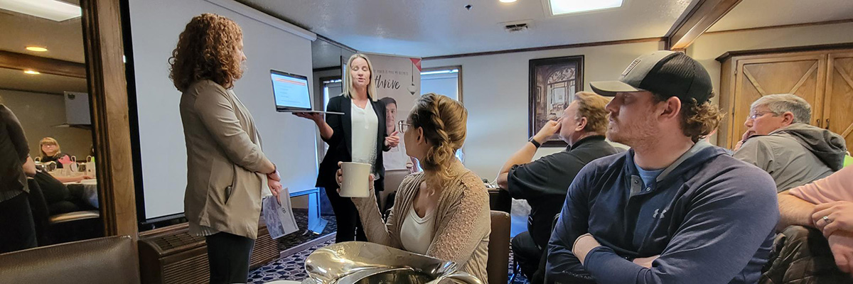 Two women present at the Chamber of Commerce Lunch and Learn in 2023